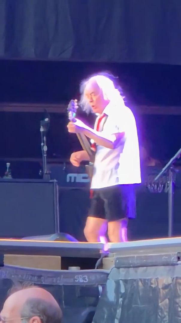 Angus Young commands the tech to crank the amp—pure rock power unleashed! ⚡🔥 #acdc #angusyoung